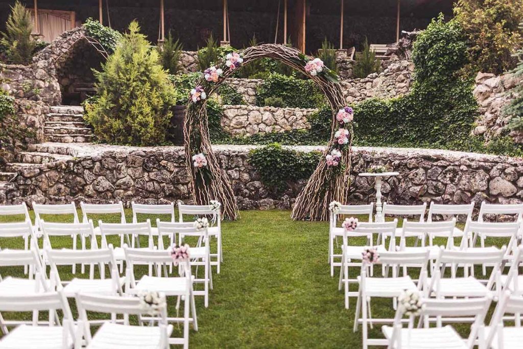 cozy-rustic-wedding-ceremony-with-flower-arch-and-LMCFPPL.jpg